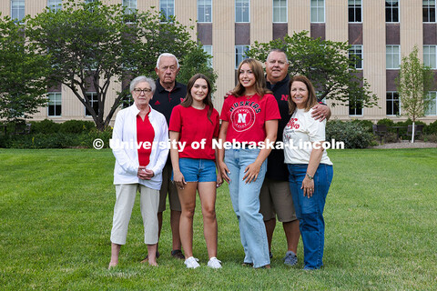 Sisters Madison and Lauren Haring pose with their family in front of Love Library. The Haring family