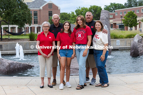 Sisters Madison and Lauren Haring pose with their family in front of Broyhill Fountain. The Haring f