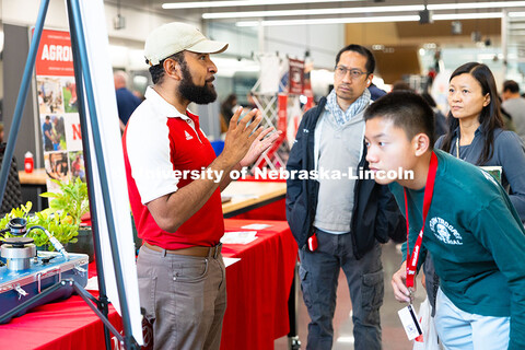 Aldi Airori, research technologist in the department of agronomy and horticulture, speaks with Natha