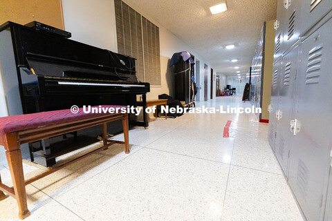 Pianos line one wall in the basement of the old Westbrook Music Building before being moved to the n