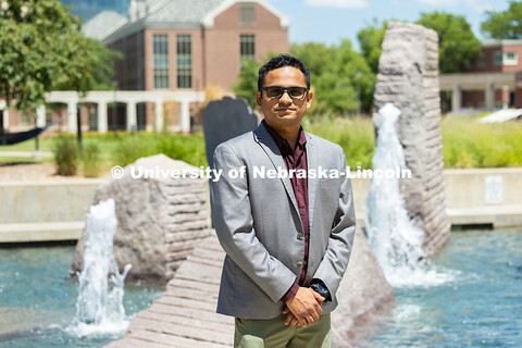 Informal portrait of Tirthankar Roy in front of Broyhill Fountain. Roy is an Assistant Professor of 
