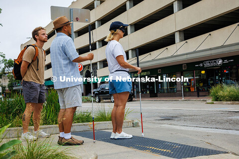 Lori Maestas stands on tactile paving, a textured surface that helps pedestrians with visual impairm