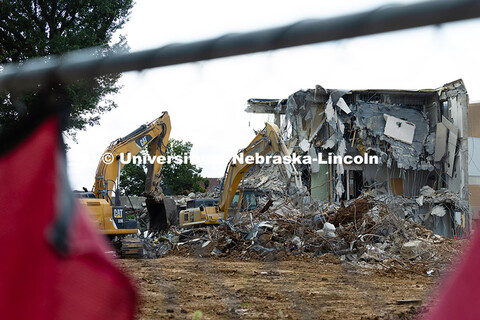 Excavators move debris from the site of the former Westbrook Music Building as the last of the north