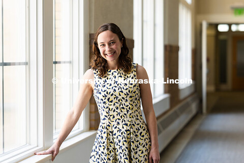 Jenna Finch, Assistant Professor of Psychology, is pictured in a hallway at Whittier School. Finch h