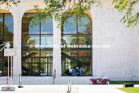 Sydney DeRoin, Chloe Burgett and Jordan Nova, all employees of the Sheldon Museum of Art, enjoy work