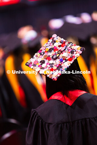 As a fashion design major, Denali Ingram used a bunch of colorful buttons to decorate her cap. Summe