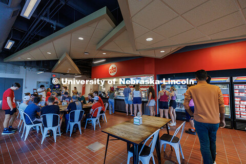 Students line up for free ice cream inside the UNL Dairy Store on East Campus during the Big Red Wel