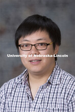 Studio portrait of Yumou Qiu, Assistant Professor, Statistics. August 20, 2014. 