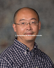 Studio portrait of Zheng Xu, Research Assistant Professor. New Faculty Orientation. August 29, 2016.