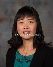 Studio portrait of Jiujiu Yu, Assistant Professor, CEHS. New Faculty Orientation. August 29, 2016. 