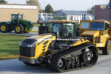 A Challenger tractor being tested pulls the test car and multiple tractors being used to provide var