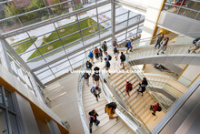 Students walk up the south staircase toward the third floor of the College of Business' new Howard L