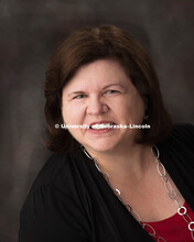 Studio portrait of Kay Dinkelman, Senior Associate Director of the Office of Scholarships and Financ