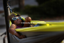 Student sleeps in one of the new hammocks next to Broyhill Fountain. September 22, 2017. 