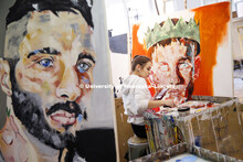 Jessica Reiter, a junior from David City, NE, works on her painting. Aaron Holz beginning painting c