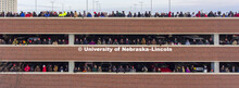 Spectators watch from the roof of the Abel Sandoz parking garage northeast of the Cather Pound Resid