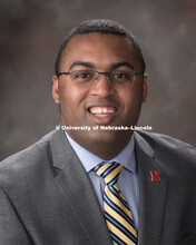 Studio portrait of Christian Robinson, Residence Director, University Housing. March 5, 2018. 