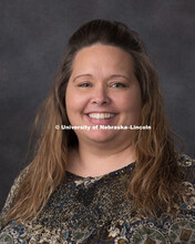 Studio portrait of Tina Kage, Project Specialist for the Office of Research and Economic Development