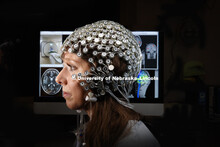 Jessie Tibbs, graduate student in clinical neuropsychology, demonstrates the MRI compatible High Den