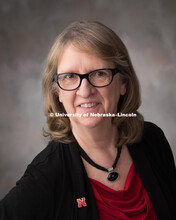 Studio portrait of Mary Guest, Executive Assistant for the Office of Research. April 17, 2018. 