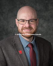 Studio portrait of Tom Gibbons, Instructional Design Tech Specialist, Online and Distance Education.