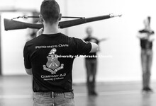Air Force Cadet 3rd Class Zachary Day leads the group in warm-ups. Pershing Rifle drill team practic