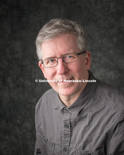 Studio portrait of Roger Simonsen, Communications and Marketing IT Director. College of Business. Ap
