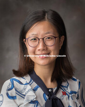 Studio portrait of Yujie Zhou, Teacher, Confucius Institute. August 6, 2018. 