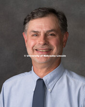 Studio portrait of Dennis Crossgrove, Central Administration. August 10, 2018. 
