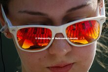 Morgan Grabowski's mallets are reflected in her sunglasses as she practices the vibraphone during Co