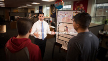 Joe Brownell, the new director of the university's Military and Veteran Success Center, talks with s