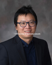 Studio portrait of GengXin Ou, Research Assistant Professor, School of Natural Resources. New Facult
