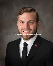 Studio portrait of David Houfek, Web Development Specialist for the Office of Graduate Studies. Sept