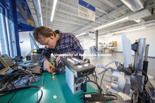 Jason Dumpert works with components in the console assembly area. Virtual Incision has relocated to 