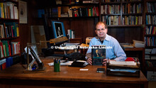 UNL History professor, David Cahan holds a copy of the biography he authored, "Helmholtz: A Life in 