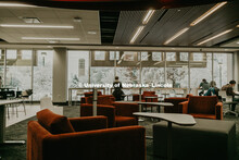 Students studying in the Adele Learning commons look out over the snow covered campus. January 12, 2