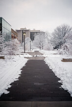 City campus covered in snow, brick walkway near Adele Learning Commons. January 12, 2019. 