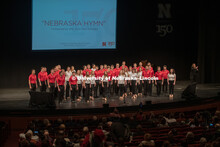 The University of Nebraska Big Red Singers (directed by Nick McGraw) sang Nebraska Hymn, which was c