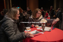 Chancellor Ronnie Green talks with attendees on the Lied Stage. All were invited to a reception on t