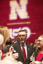 Chancellor Ronnie Green talks with attendees on the Lied Stage. All were invited to a reception on t