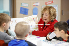 Laurie Bellows, Interim Vice Chancellor for Student Affairs, reads at the YMCA of Lincoln-Northeast 