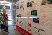 Diane Mendenhall, part of the Chancellor's Executive Team, look over the traveling history exhibit i