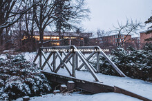 Snow covered bridge in the Maxwell Arboretum between the C.Y. Thompson Library and the College of De