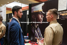 Taylor Gannon talks with a recruiter from The US Marines at the STEM Career Fair (Science, Technolog