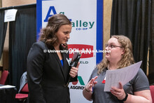 Madison Mills talks with a recruiter from Ag Valley Co-op at the STEM Career Fair (Science, Technolo