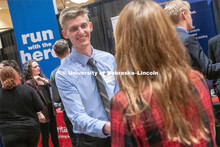 Ryan Soderquist speaks with a recruit at the STEM Career Fair (Science, Technology, Engineering, and
