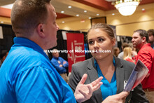 Angelica Wellman speaks with a recruiter at the STEM Career Fair (Science, Technology, Engineering, 