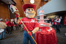 Herbie holds the new mace that was created for the Chancellor to carry at commencement. The mace fea