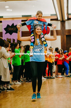 Dance Marathon attendees form a tunnel for the Miracle kids to run through. Miracle kids shown with 