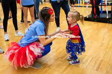 Student engaging with miracle child dressed as Wonder Woman. 1274 Nebraska students signed up to be 